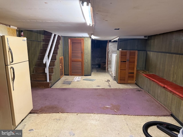 914 Fernon St, Philadelphia, PA 19148 - finished below grade area with freestanding refrigerator, stairs, and wooden walls