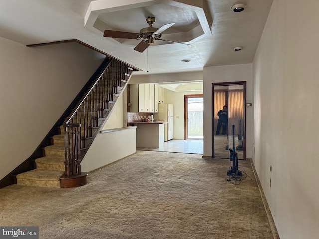 914 Fernon St, Philadelphia, PA 19148 - unfurnished living room with light colored carpet, a ceiling fan, stairs, and baseboards