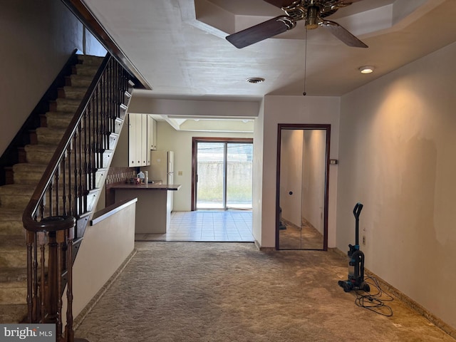 914 Fernon St, Philadelphia, PA 19148 - foyer entrance with light colored carpet, a ceiling fan, and stairway