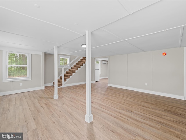 25308 Nanticoke Rd, Quantico, MD 21856 - basement with light wood-type flooring, baseboards, and stairway