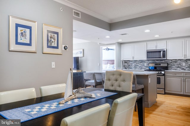 1201 N Garfield St Unit 604, Arlington, VA 22201 - dining area featuring ornamental molding, light wood finished floors, and recessed lighting