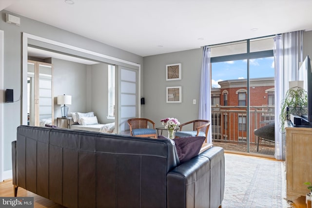 1201 N Garfield St Unit 604, Arlington, VA 22201 - living room featuring plenty of natural light and light wood-style floors