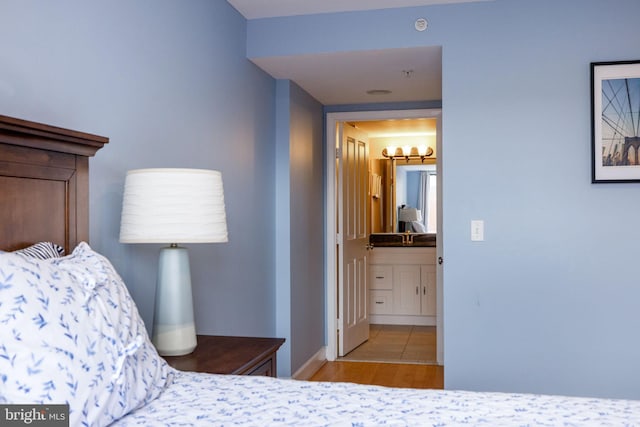 1201 N Garfield St Unit 604, Arlington, VA 22201 - bedroom with baseboards and wood finished floors