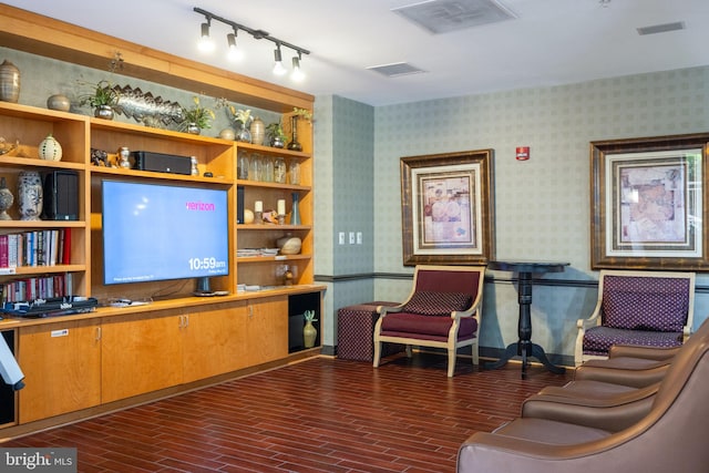1201 N Garfield St Unit 604, Arlington, VA 22201 - living area with wallpapered walls, rail lighting, dark wood-style flooring, and baseboards