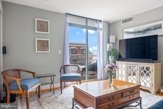 1201 N Garfield St Unit 604, Arlington, VA 22201 - living room featuring baseboards and wood finished floors