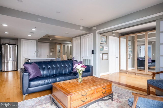 1201 N Garfield St Unit 604, Arlington, VA 22201 - living area featuring light wood-style flooring and recessed lighting
