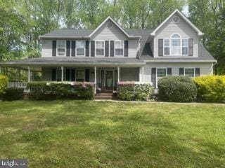 600 Small Reward Rd, Huntingtown, MD 20639 - view of front facade with a front yard and a porch