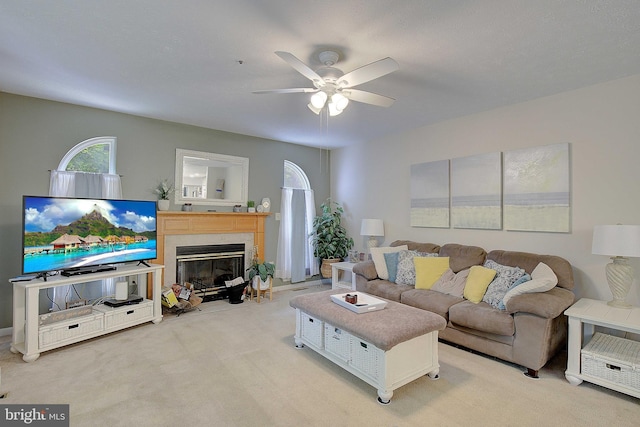 600 Small Reward Rd, Huntingtown, MD 20639 - living area with ceiling fan, a fireplace with flush hearth, and light carpet