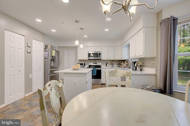 600 Small Reward Rd, Huntingtown, MD 20639 - kitchen featuring appliances with stainless steel finishes, recessed lighting, white cabinetry, a kitchen island, and light countertops