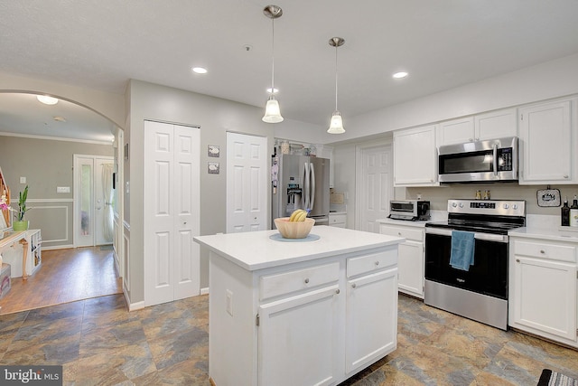 600 Small Reward Rd, Huntingtown, MD 20639 - kitchen with stainless steel appliances, arched walkways, stone finish flooring, white cabinets, and crown molding
