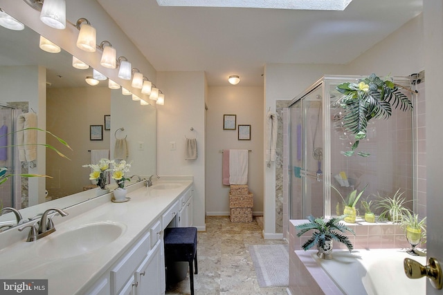 600 Small Reward Rd, Huntingtown, MD 20639 - bathroom featuring double vanity, a stall shower, a bath, and baseboards