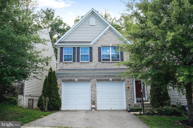 3441 Eagle Ridge Dr, Woodbridge, VA 22191 - view of front of house featuring an attached garage, asphalt driveway, and brick siding