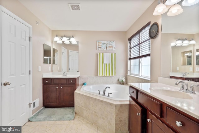 3441 Eagle Ridge Dr, Woodbridge, VA 22191 - bathroom featuring two vanities, a garden tub, and tile patterned floors