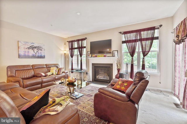 3441 Eagle Ridge Dr, Woodbridge, VA 22191 - carpeted living area featuring healthy amount of natural light, baseboards, and a fireplace with flush hearth