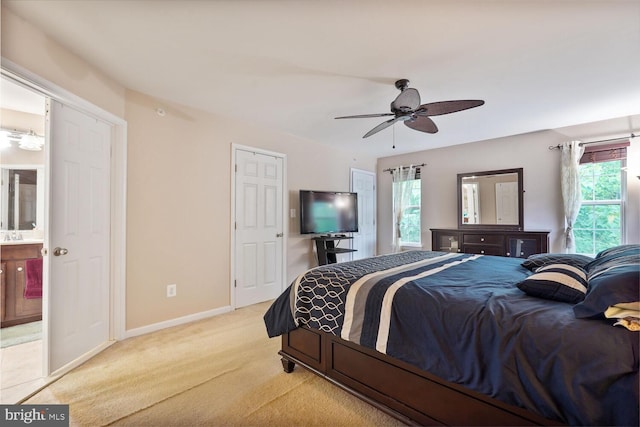 3441 Eagle Ridge Dr, Woodbridge, VA 22191 - bedroom featuring light carpet, baseboards, ceiling fan, and ensuite bath