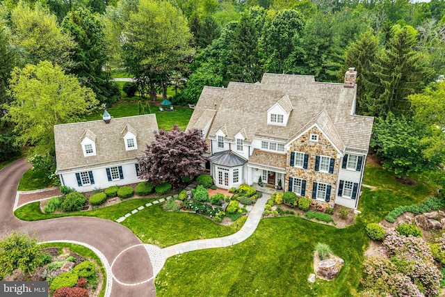 1298 Farm Ln, Berwyn, PA 19312 - view of front of home featuring a chimney, a front lawn, stone siding, and french doors
