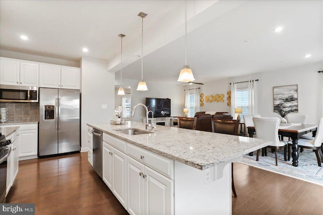 5829 Barts Way, Frederick, MD 21704 - kitchen featuring stainless steel appliances, a sink, dark wood-style floors, white cabinets, and decorative backsplash