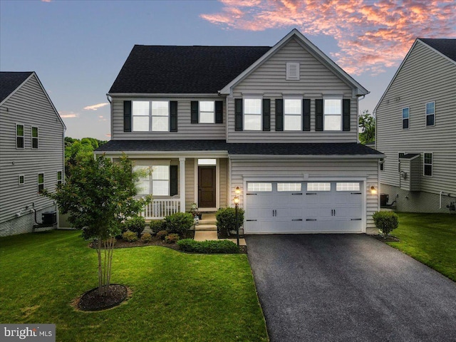 5829 Barts Way, Frederick, MD 21704 - traditional home with an attached garage, a porch, asphalt driveway, and a lawn