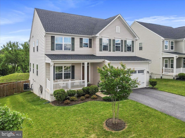 5829 Barts Way, Frederick, MD 21704 - traditional home with a garage, covered porch, central AC unit, roof with shingles, and asphalt driveway