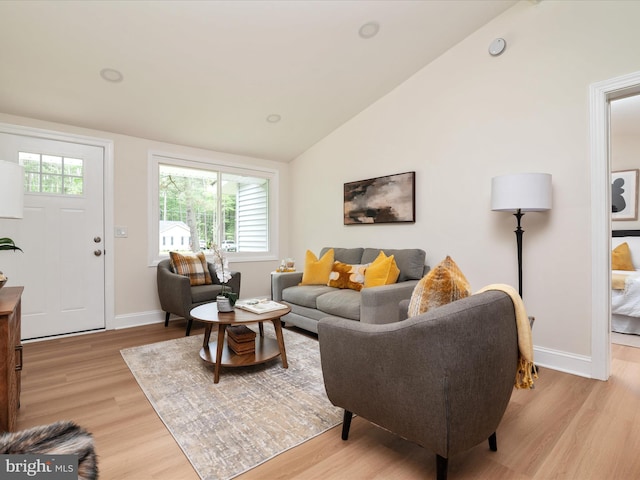 137 Olive Branch Rd, Stevensville, MD 21666 - living area with light wood-style floors, vaulted ceiling, and baseboards