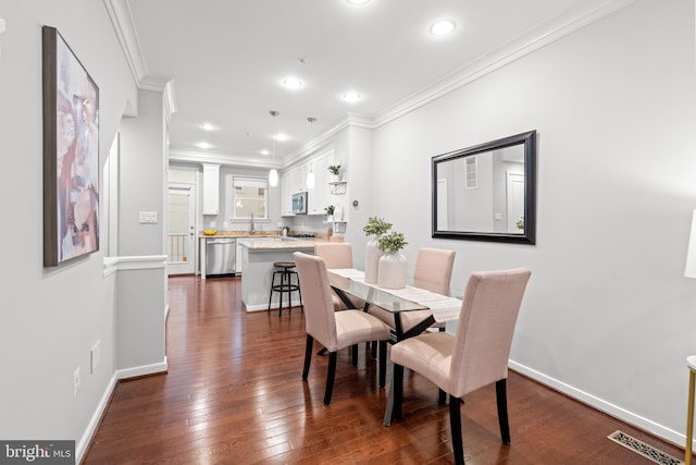 331 K St SE, Washington, DC 20003 - dining room featuring crown molding, dark wood-style floors, baseboards, and recessed lighting