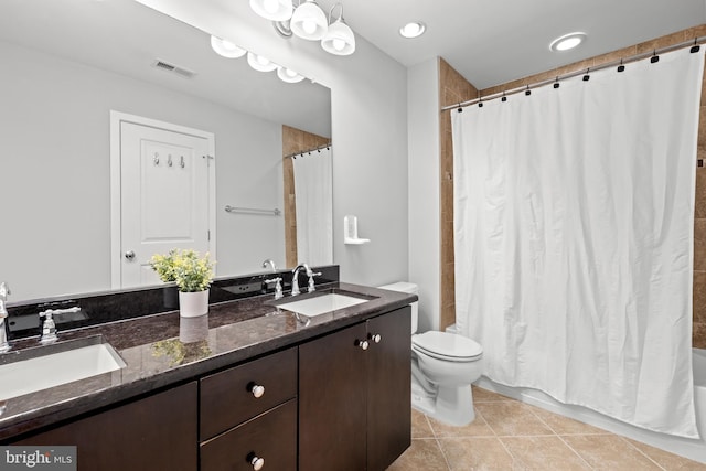 331 K St SE, Washington, DC 20003 - bathroom featuring double vanity, toilet, tile patterned flooring, and shower / bath combo with shower curtain
