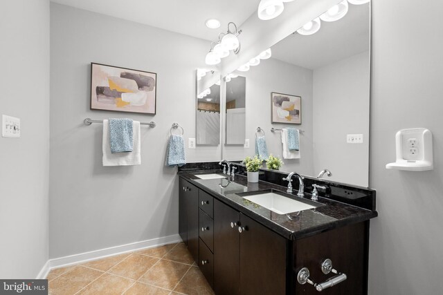 331 K St SE, Washington, DC 20003 - full bathroom with baseboards, double vanity, and tile patterned flooring