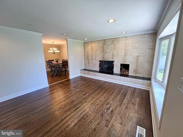 930 Chesaco Ave, Baltimore, MD 21237 - unfurnished living room with a fireplace, a chandelier, dark wood finished floors, crown molding, and recessed lighting