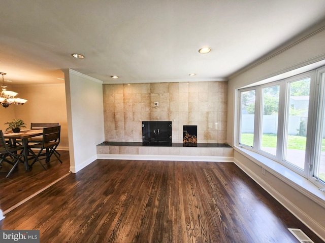 930 Chesaco Ave, Baltimore, MD 21237 - unfurnished living room featuring ornamental molding, baseboards, a tiled fireplace, dark wood-type flooring, and recessed lighting