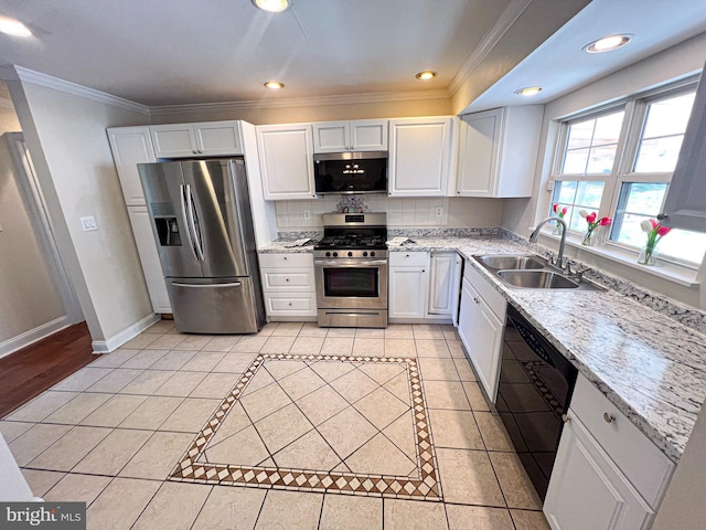 930 Chesaco Ave, Baltimore, MD 21237 - kitchen with appliances with stainless steel finishes, a sink, white cabinetry, crown molding, and light tile patterned floors