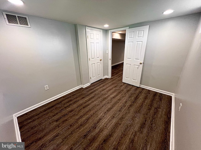 930 Chesaco Ave, Baltimore, MD 21237 - finished below grade area featuring dark wood-style floors, recessed lighting, and baseboards