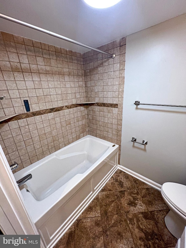 930 Chesaco Ave, Baltimore, MD 21237 - bathroom with toilet, shower / bathtub combination, and baseboards
