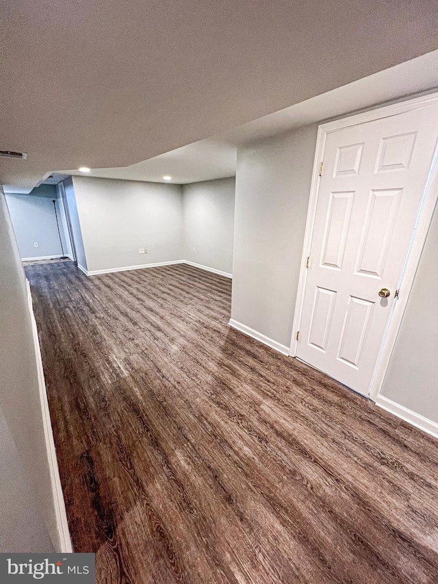 930 Chesaco Ave, Baltimore, MD 21237 - finished below grade area with dark wood-style floors and baseboards