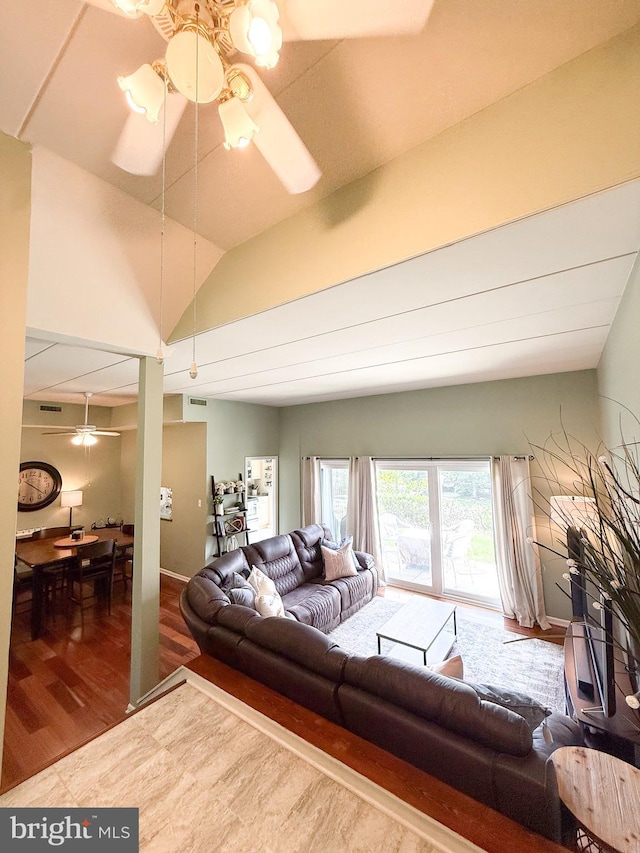 128 Roberts Ln Unit 100, Alexandria, VA 22314 - living room featuring ceiling fan, wood finished floors, and vaulted ceiling