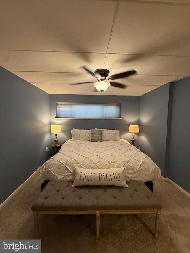 128 Roberts Ln Unit 100, Alexandria, VA 22314 - carpeted bedroom featuring a ceiling fan and baseboards