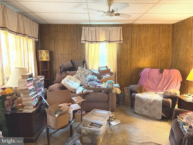 67 Fairfield St, Carlisle, PA 17013 - living area with ceiling fan, a drop ceiling, wood walls, and carpet floors