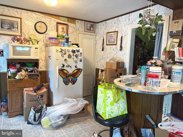 67 Fairfield St, Carlisle, PA 17013 - kitchen with white appliances, crown molding, and wallpapered walls