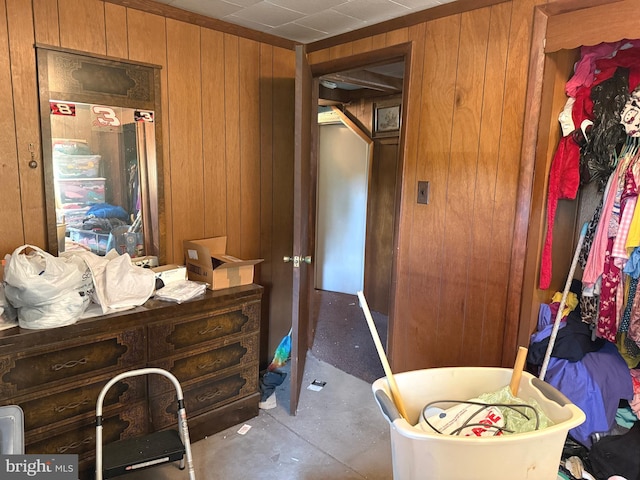 67 Fairfield St, Carlisle, PA 17013 - bedroom with wooden walls and unfinished concrete floors