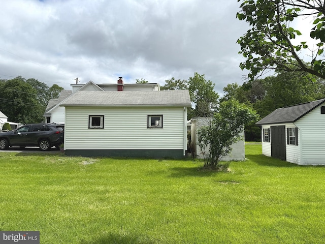 67 Fairfield St, Carlisle, PA 17013 - rear view of house featuring a lawn