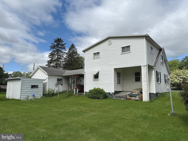 67 Fairfield St, Carlisle, PA 17013 - back of property featuring a lawn and an outdoor structure