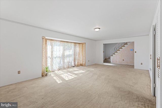 43 Windsor Ln, Willingboro, NJ 08046 - unfurnished living room featuring stairway and carpet flooring