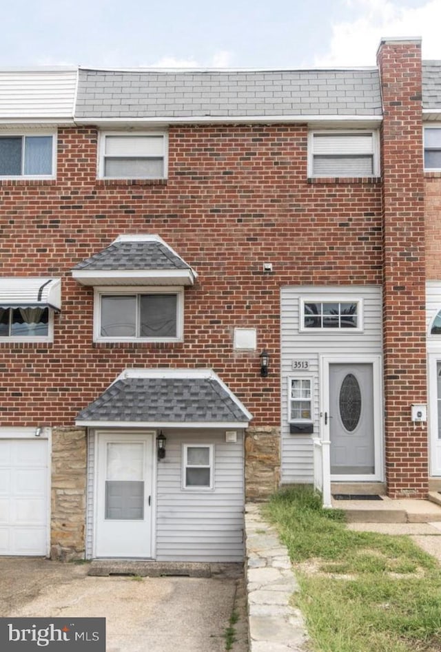 3513 E Crown Ave, Philadelphia, PA 19114 - view of property featuring brick siding and a shingled roof
