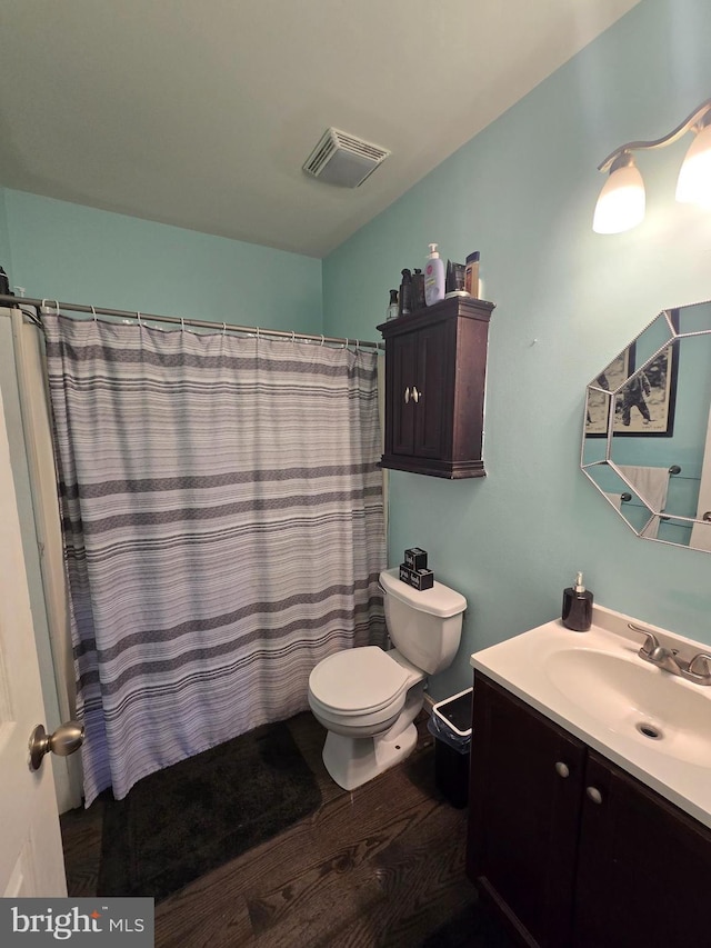 300 N Orchard Rd, Vineland, NJ 08360 - full bath featuring toilet, wood finished floors, vanity, and curtained shower