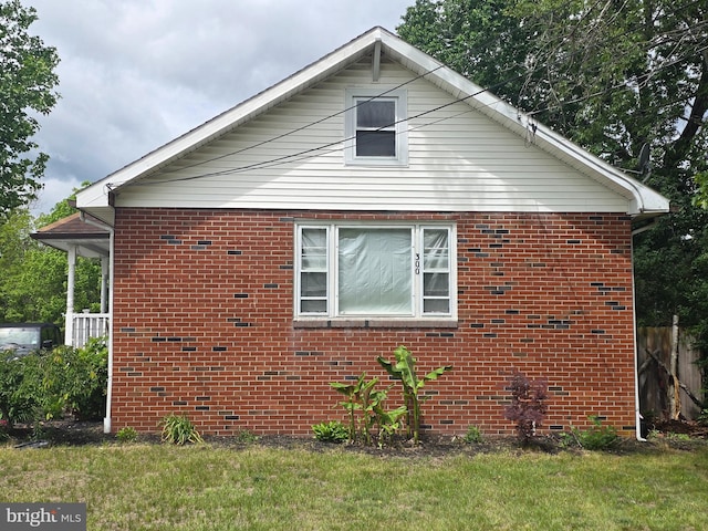 300 N Orchard Rd, Vineland, NJ 08360 - view of home's exterior with brick siding and a lawn