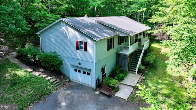 1420 Fishel Rd, Winchester, VA 22602 - view of front of property with stairs, a garage, a shingled roof, asphalt driveway, and covered porch