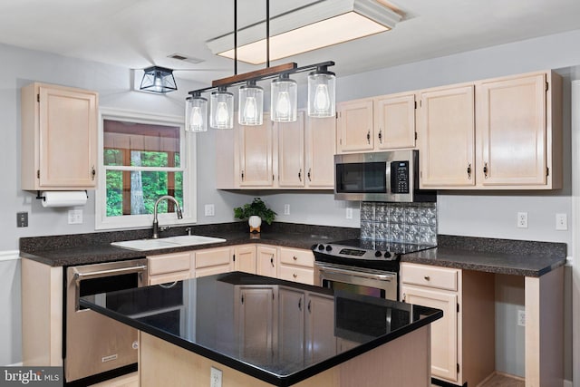 1420 Fishel Rd, Winchester, VA 22602 - kitchen featuring stainless steel appliances, a sink, dark countertops, and a kitchen island