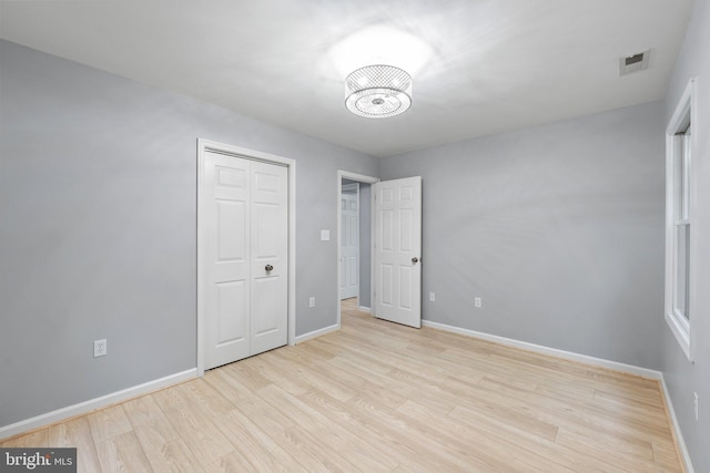 1420 Fishel Rd, Winchester, VA 22602 - unfurnished bedroom with light wood finished floors, baseboards, and a closet