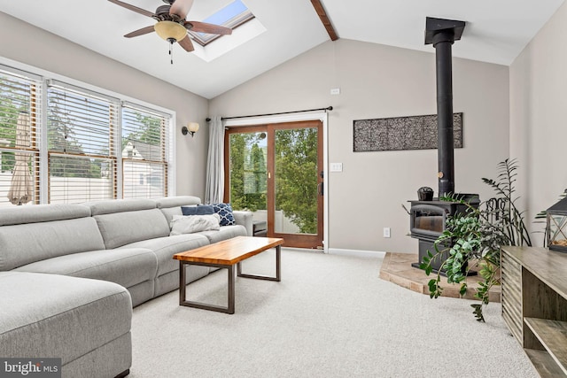 808 Scotia Rd, Philadelphia, PA 19128 - carpeted living area with a wood stove, a ceiling fan, vaulted ceiling, and baseboards