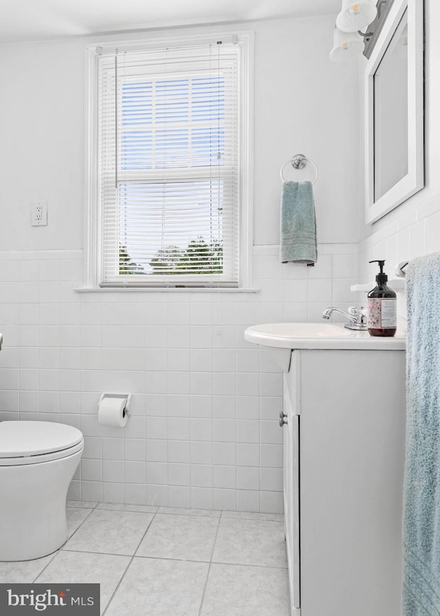 808 Scotia Rd, Philadelphia, PA 19128 - bathroom featuring tile walls, vanity, tile patterned floors, a wainscoted wall, and toilet