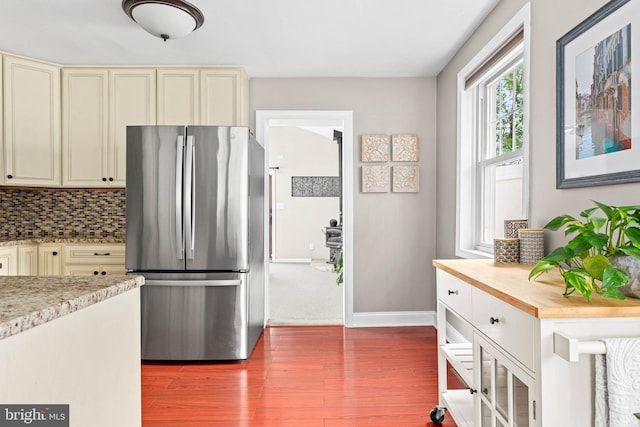 808 Scotia Rd, Philadelphia, PA 19128 - kitchen with freestanding refrigerator, cream cabinetry, wood finished floors, tasteful backsplash, and baseboards